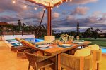 Outdoor dining is a must on Maui and this beautiful teak wood table comfortably seats 6 with incredible golf course and peek-a-boo blue water views of Kaanapali.